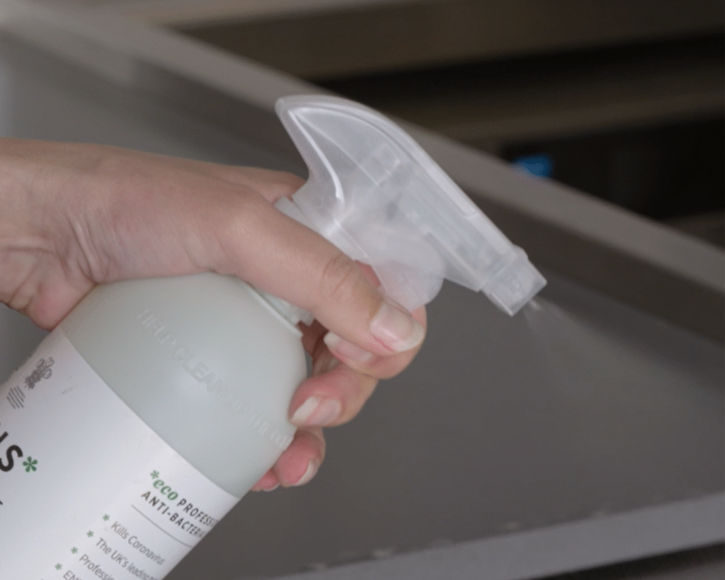 sanitiser being sprayed onto food prep surface to remove allergens